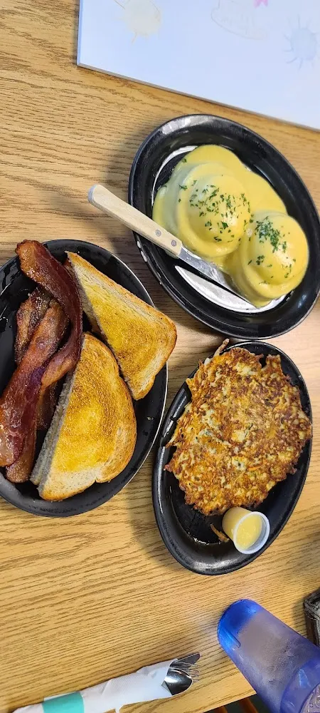 Eggs Benedict Sourdough Toast Bacon and a Potato Pancake